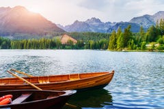 Boat on the dock surrounded mountains. Fantastic Shtrbske Pleso High Tatras. Slovakia royalty free stock image Boat on the dock surrounded mountains. Fantastic Shtrbske Pleso High Tatras. Slovakia royalty free stock image