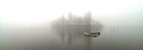 Boat On Misty Lake Stock Image