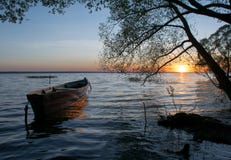 Boat sun lake summer sunset holiday wide royalty free stock photography Boat sun lake summer sunset holiday wide royalty free stock photography