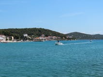 Boats approaching small town of Tisno on the Murter island, Croatia, famous for summer music festivals and wonderful turquoise sea
