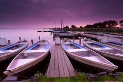 Boats By Pier On Lake Haven During Sunrise Stock Image Boats By Pier On Lake Haven During Sunrise Stock Image