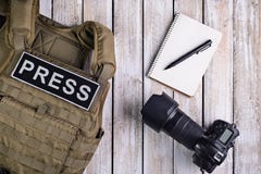 Body armor for journalist, notebook and camera Stock Photo Body armor for journalist, notebook and camera Stock Photo