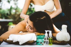 Body care. Young Asian Woman having massage with hot herbal balls for deep relaxation , stock photos Body care. Young Asian Woman having massage with hot herbal balls for deep relaxation , stock photos