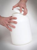 Bodybuilding and Sports themehands holding a plastic jar with a royalty free stock photos Bodybuilding and Sports themehands holding a plastic jar with a royalty free stock photos