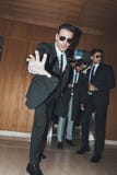 bodyguard in sunglasses stopping paparazzi when celebrity going out from stock photos bodyguard in sunglasses stopping paparazzi when celebrity going out from stock photos
