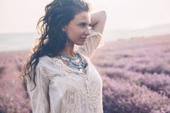 Boho styled model in lavender field stock photos Boho styled model in lavender field stock photos