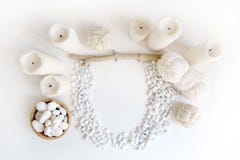 Boho white mockup with candles, cotton yarn and white sea pebble on the desk. Top view flat lay. Space for your text royalty free stock photography Boho white mockup with candles, cotton yarn and white sea pebble on the desk. Top view flat lay. Space for your text royalty free stock photography