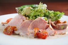 Boiled eggs with smoked ham and vegetables on white plate Stock Photos Boiled eggs with smoked ham and vegetables on white plate Stock Photos