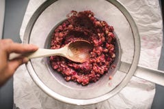 Boiled White and red currant berries, extracting juice royalty free stock photo Boiled White and red currant berries, extracting juice royalty free stock photo