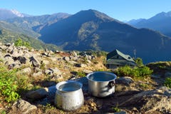 Big aluminum cooking pots surrounded in an amazing natural setting, Num, Nepal stock photography Big aluminum cooking pots surrounded in an amazing natural setting, Num, Nepal stock photography