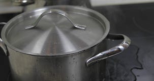 Boiling Water In The Pan that is covered with a lid in the kitchen royalty free stock image Boiling Water In The Pan that is covered with a lid in the kitchen royalty free stock image