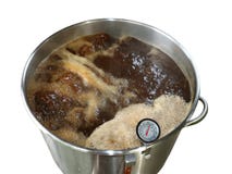 Boiling Wort for Home Brewed Brown Ale on White Background stock photography Boiling Wort for Home Brewed Brown Ale on White Background stock photography