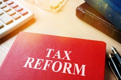 Book with title Tax reform on a table. stock images Book with title Tax reform on a table. stock images