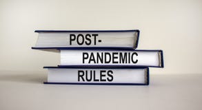 Books with text `post-pandemic rules` on beautiful white background. Business and post-pandemic concept. Copy space