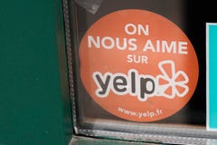 Yelp guide emblem sign text and brand Logo on Business windows bar restaurant