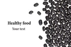Border of black kidney beans closeup with copy space on white background. Royalty Free Stock Photos Border of black kidney beans closeup with copy space on white background. Royalty Free Stock Photos