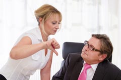 Boss and his secretary at desk Royalty Free Stock Photos Boss and his secretary at desk Royalty Free Stock Photos