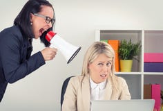 Boss shouting at employee on megaphone stock photo Boss shouting at employee on megaphone stock photo