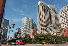 Boston MA USA 04.09.2017 skyline summer day panoramic view buildings downtown and road with traffic at waterfront side Stock Photos Boston MA USA 04.09.2017 skyline summer day panoramic view buildings downtown and road with traffic at waterfront side Stock Photos