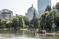 Boston, Massachusetts, USA 06.09.2017 tourists enjoying ride on famous swan boats at Boston Public Garden sunny day stock photo Boston, Massachusetts, USA 06.09.2017 tourists enjoying ride on famous swan boats at Boston Public Garden sunny day stock photo