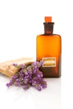 Bottle with aroma oil and lavender flowers isolated on white. Ar stock image Bottle with aroma oil and lavender flowers isolated on white. Ar stock image
