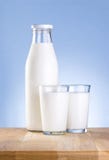 Bottle of milk and two glass is wooden table royalty free stock photos Bottle of milk and two glass is wooden table royalty free stock photos