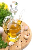 Bottle Of Olive Oil, Garlic, Spices And Fresh Herbs On Board Royalty Free Stock Image