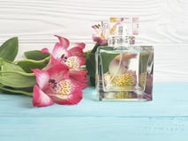 Bottle of perfume flower alstroemeria decoration beautiful on a wooden background royalty free stock photography Bottle of perfume flower alstroemeria decoration beautiful on a wooden background royalty free stock photography