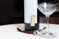 A bottle of red wine, a glass and a corkscrew royalty free stock images A bottle of red wine, a glass and a corkscrew royalty free stock images