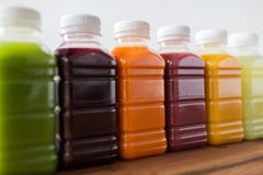 Bottles with different fruit or vegetable juices stock photo Bottles with different fruit or vegetable juices stock photo