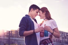 Pretty expressive young couple staying closely to each other stock photography Pretty expressive young couple staying closely to each other stock photography