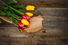 Bouquet of fresh colorful tulips over rustic wooden background. royalty free stock photos Bouquet of fresh colorful tulips over rustic wooden background. royalty free stock photos