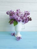 Bouquet of lilac in a vase on a rustic wooden royalty free stock photo Bouquet of lilac in a vase on a rustic wooden royalty free stock photo
