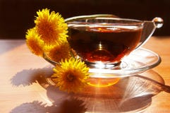 Bouquet Of Dandelions And Cup Of Tea Stock Images