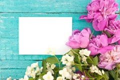 Bouquet of pink peony and mock-orange flowers on turquoise rusti Stock Image Bouquet of pink peony and mock-orange flowers on turquoise rusti Stock Image