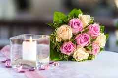 Bouquet of roses on table with candle stock image Bouquet of roses on table with candle stock image