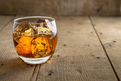 Bourbon scotch whiskey whisky glass fine art classy artistic rustic wooden barrel background