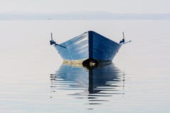 Bow Of The Boat Is Reflected In The Water Stock Photo