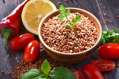 Bowl of buckwheat kasha on wooden table Royalty Free Stock Images Bowl of buckwheat kasha on wooden table Royalty Free Stock Images