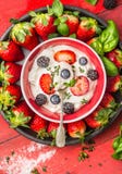 Bowl with cottage cheese, summer berries: blackberries, blueberries, strawberries and spoon, top view Stock Photography Bowl with cottage cheese, summer berries: blackberries, blueberries, strawberries and spoon, top view Stock Photography