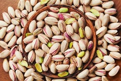 Bowl of pistachio nuts on wooden table top view. Healthy food and snack. royalty free stock photos Bowl of pistachio nuts on wooden table top view. Healthy food and snack. royalty free stock photos