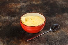 Bowl of wheat porridge and spoon, tasty breakfast Stock Photography Bowl of wheat porridge and spoon, tasty breakfast Stock Photography