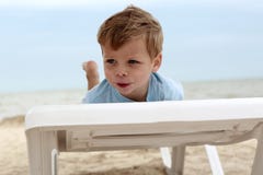 Boy on beach sunbed royalty free stock photography Boy on beach sunbed royalty free stock photography