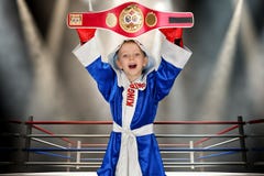 Boy boxer holding championship belt in Boxing. Little champion.The big wins. stock photos Boy boxer holding championship belt in Boxing. Little champion.The big wins. stock photos