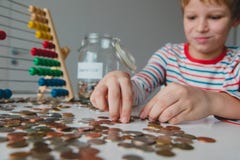 Boy Counting Money, Kid Saving Coins, Personal Finances For Kids Stock Image