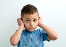The boy covered his ears with his hands royalty free stock photography The boy covered his ears with his hands royalty free stock photography