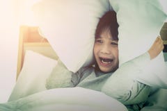 Boy Covering Ear With Pillow After Waking Up From Nightmare Sleepless Insomnia Night On Bed In The Morning Royalty Free Stock Photo