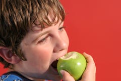 Boy Eating An Apple Stock Photo