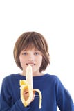 Boy Eating Banana Stock Photography