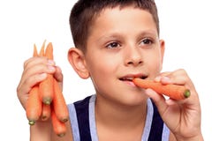 Boy Eating Carrot Stock Photography